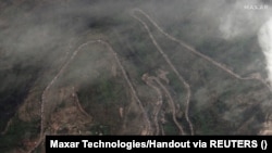 A satellite image shows a long traffic jam of vehicles along the Lachin corridor as ethnic Armenians flee Nagorno-Karabakh, September 26, 2023.