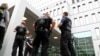 German police officers stand guard outside the hospital in Berlin where Russian opposition leader Aleksei Navalny is receiving medical treatment. 