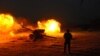 An Afghan Army soldier fires an artillery shell during an ongoing anti-Taliban operation in Farah Province earlier this year. (file photo)