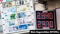 Ряд аналитиков увидели связь между усилением лари и предстоящим парламентским отчетом президента Нацбанка Грузии Георгия Кадагидзе