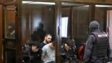 A group of defendants accused of involvement in the 2024 Crocus City Hall music venue gun attack that killed 149 people, goes on trial in Moscow on August 4, 2025. (Photo by Alexander NEMENOV / AFP)