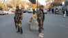 Taliban fighters watch a street in Kabul. (file photo)