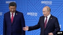 Лідери Китаю і Росії Сі Цзіньпін і Володимир Путін під час саміту БРІКС у Казані. РФ, 23 жовтня 2024 року