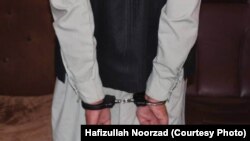 ارشیف، فراه کې د نشه‌یي موادو یو نیول شوی قاچاق کوونکی او پلورونکی