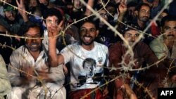 Pakistani supporters of opposition politician Imran Khan gather during an anti-government protest in front of parliament in Islamabad on August 20, 2014. 