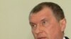 Igor Sechin emerges from a government session on May 15