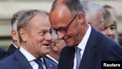 Polşa baş naziri Donald Tusk və Almaniya kansleri Fridrix Merts